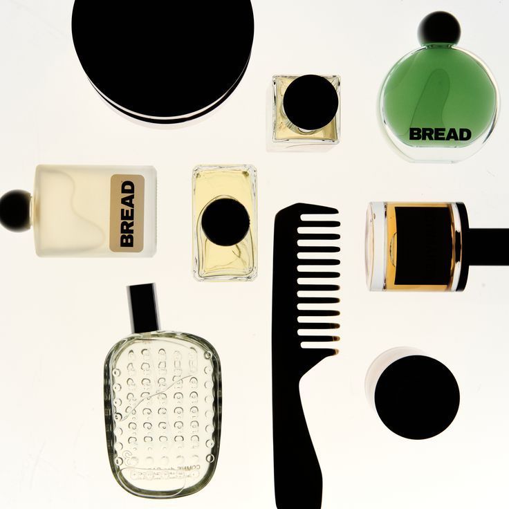 Flat lay with various bottles, jars, and a comb