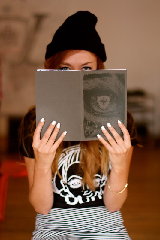 Woman holding a book.