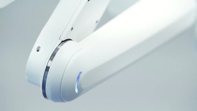 Robot arm with blue light.