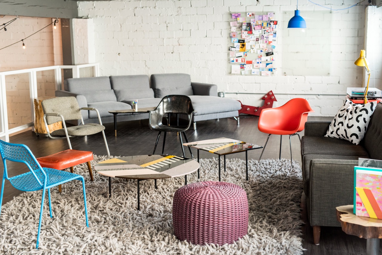 Living room with red chairs.