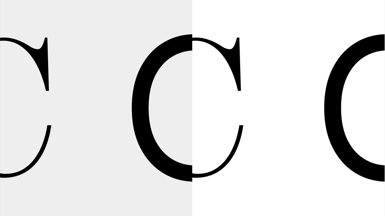 Black and white letter c with tail on top.